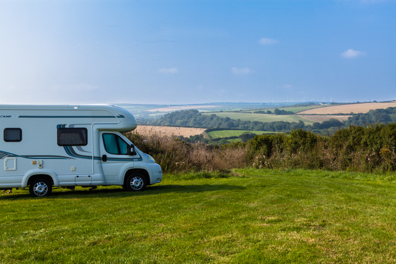 Motorhome on grass overlooking the rural fields around Ponderosa